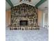 Spacious living room featuring a stone fireplace and a door leading to the porch at 2316 Emerald Dr, Jonesboro, GA 30236