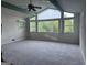 Bright and airy living room with large windows offering scenic views of the surrounding trees at 2316 Emerald Dr, Jonesboro, GA 30236
