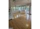 Open living area with hardwood floors and large windows with a view to outside at 2316 Emerald Dr, Jonesboro, GA 30236