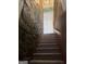 Unique staircase featuring stone wall accents and carpeted steps at 2316 Emerald Dr, Jonesboro, GA 30236