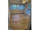 Bright sunroom features newer flooring, ample natural light, and access to the backyard at 2316 Emerald Dr, Jonesboro, GA 30236