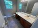 Well-lit bathroom with a large vanity and plenty of counter space at 194 Bay Court Dr, Stockbridge, GA 30281
