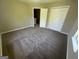 Spacious bedroom featuring carpeting and a closet at 194 Bay Court Dr, Stockbridge, GA 30281