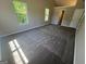 Bedroom featuring large windows and plush carpeting at 194 Bay Court Dr, Stockbridge, GA 30281