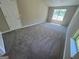 Bedroom featuring large windows and plush carpeting at 194 Bay Court Dr, Stockbridge, GA 30281