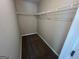 A view of a walk-in closet with shelves and carpet at 194 Bay Court Dr, Stockbridge, GA 30281