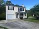 Charming two-story home with a well-maintained front yard and attached garage at 194 Bay Court Dr, Stockbridge, GA 30281
