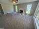 Spacious living room featuring a fireplace, neutral walls, and ample natural light from large windows at 194 Bay Court Dr, Stockbridge, GA 30281