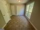 Bright room with large windows and closet space, featuring light tile flooring at 194 Bay Court Dr, Stockbridge, GA 30281