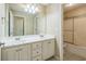 Bathroom featuring double sinks, and a shower over the tub at 1201 Turtle Creek Ct, Lawrenceville, GA 30043