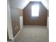 Attic bedroom featuring neutral carpet, and a window at 1201 Turtle Creek Ct, Lawrenceville, GA 30043