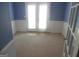 Bedroom featuring blue walls, white trim and doors to a back deck at 1201 Turtle Creek Ct, Lawrenceville, GA 30043