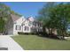 Beautiful two-story home with stone facade, well-manicured lawn, and a two car garage at 1201 Turtle Creek Ct, Lawrenceville, GA 30043