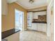 Clean kitchen with white cabinets and appliances with contrasting countertops at 1201 Turtle Creek Ct, Lawrenceville, GA 30043