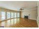 Spacious living room with fireplace, ceiling fan and access to a outdoor deck at 1201 Turtle Creek Ct, Lawrenceville, GA 30043
