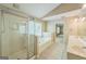 Well-lit main bathroom featuring a shower, soaking tub and large vanity at 1201 Turtle Creek Ct, Lawrenceville, GA 30043
