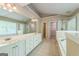 Main bathroom with double vanity, tiled floor, soaking tub and walk-in shower at 1201 Turtle Creek Ct, Lawrenceville, GA 30043