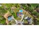 Bird's-eye view of a property featuring a pool, trampoline, and circular driveway at 229 Primstone Way, Mcdonough, GA 30253