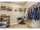 Spacious walk in closet featuring built in shelving, hanging rods and shoe racks at 229 Primstone Way, Mcdonough, GA 30253