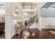 Grand foyer featuring hardwood floors, wainscoting, and a staircase leading to the second floor at 229 Primstone Way, Mcdonough, GA 30253