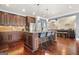 Beautiful kitchen with stainless steel appliances, a large island, and custom cabinetry at 229 Primstone Way, Mcdonough, GA 30253