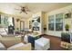 Covered patio area with comfortable seating, a fireplace, and an outdoor television at 229 Primstone Way, Mcdonough, GA 30253