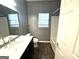 Bathroom with wood-look floor, single sink vanity, and bathtub at 4254 Wood Cove Dr, Snellville, GA 30039