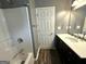 Bathroom featuring a shower-tub combo and single sink vanity at 4254 Wood Cove Dr, Snellville, GA 30039
