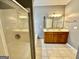 Main bathroom featuring double vanity, tiled flooring and walk-in shower at 4254 Wood Cove Dr, Snellville, GA 30039
