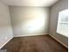 Simple bedroom with light walls and a window at 4254 Wood Cove Dr, Snellville, GA 30039