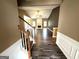 Open-concept living room with high ceilings, hardwood floors, and fireplace at 4254 Wood Cove Dr, Snellville, GA 30039