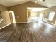 Spacious living area with hardwood floors, adjoining dining area and neutral tones at 4254 Wood Cove Dr, Snellville, GA 30039