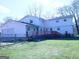 Large backyard with a wooden deck, some fencing, green grass and a detached garage at 30 Hickory Dr, Stockbridge, GA 30281