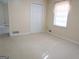 Cozy bedroom with plush carpet, closet and natural light through the window at 30 Hickory Dr, Stockbridge, GA 30281