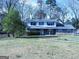 Charming two-story home featuring a stone facade and well-maintained lawn at 30 Hickory Dr, Stockbridge, GA 30281