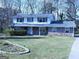 Charming two-story home featuring a stone facade and well-maintained lawn at 30 Hickory Dr, Stockbridge, GA 30281