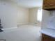 Spacious living room with carpeted floors and plenty of natural light at 30 Hickory Dr, Stockbridge, GA 30281