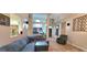Bright living room featuring a fireplace, ceiling fan, neutral walls, speakers, and tile flooring at 725 White Dove Dr, Mcdonough, GA 30253