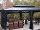 Relaxing patio area with a black metal gazebo and ample seating at 725 White Dove Dr, Mcdonough, GA 30253