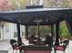 Covered outdoor space with elegant patio furniture and a cozy heater for outdoor enjoyment at 725 White Dove Dr, Mcdonough, GA 30253