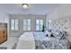 Bedroom with natural light, carpet floors, shuttered windows and upholstered headboard at 7920 Willoughby Ct, Alpharetta, GA 30005