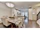 Elegant dining area with a marble table and open floor plan to kitchen at 7920 Willoughby Ct, Alpharetta, GA 30005