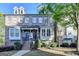Charming brick townhome with well-manicured landscaping and inviting entryway at 7920 Willoughby Ct, Alpharetta, GA 30005
