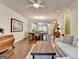 Spacious living room with hardwood floors, an open floor plan, and ample natural light at 7920 Willoughby Ct, Alpharetta, GA 30005