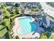 Aerial view of community pool, clubhouse and lounge chairs in a residential neighborhood at 7920 Willoughby Ct, Alpharetta, GA 30005
