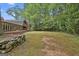 A spacious backyard with mature trees surrounding the area, offering plenty of privacy at 115 Ebenezer Church Rd, Fayetteville, GA 30215