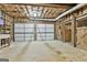 The unfinished basement is spacious, featuring concrete floors and wooden beam ceilings at 115 Ebenezer Church Rd, Fayetteville, GA 30215