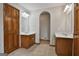 Large bathroom featuring double vanities, tiled floors, and a doorway to another room at 115 Ebenezer Church Rd, Fayetteville, GA 30215