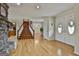 Spacious foyer with hardwood floors, a staircase, and double doors leading to the outside at 115 Ebenezer Church Rd, Fayetteville, GA 30215