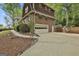 Brick home with a two-car garage and well-maintained landscaping at 115 Ebenezer Church Rd, Fayetteville, GA 30215